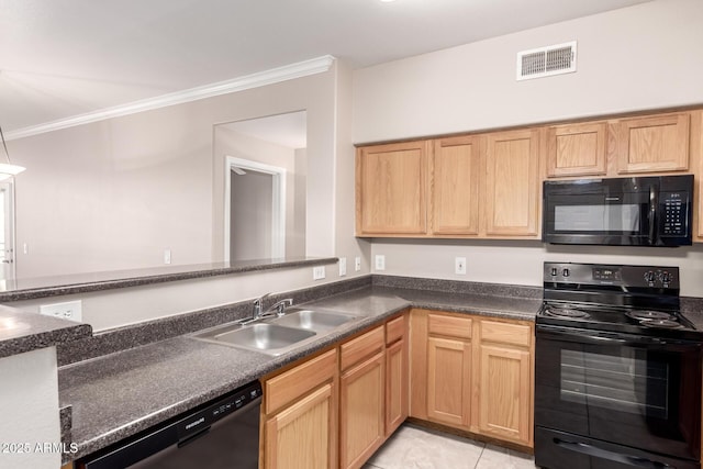 kitchen featuring visible vents, a sink, black appliances, and dark countertops