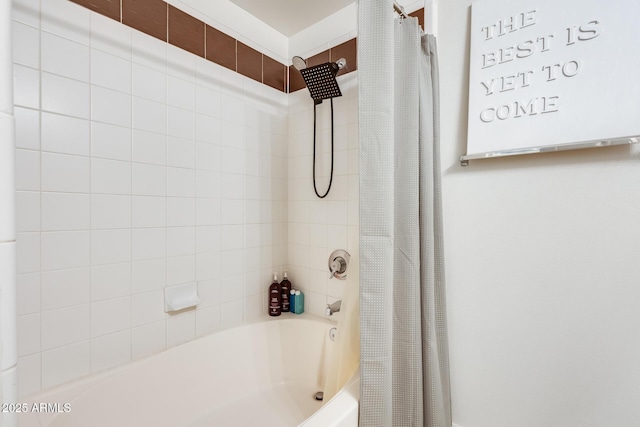 bathroom with shower / bath combo with shower curtain