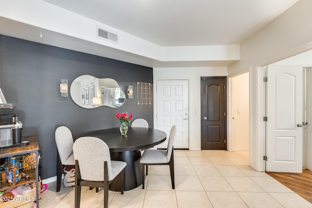 dining space with light tile patterned floors