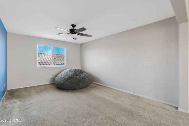 unfurnished room featuring carpet and ceiling fan