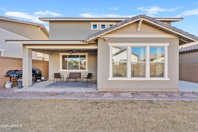 back of house with a patio and ceiling fan