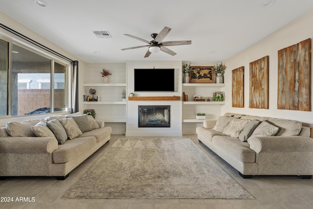 tiled living room featuring ceiling fan