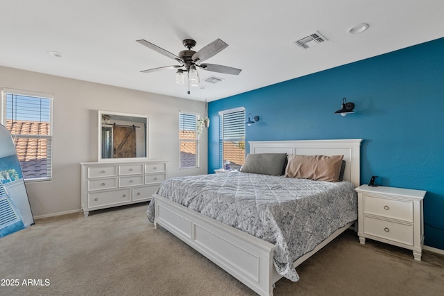 carpeted bedroom with ceiling fan