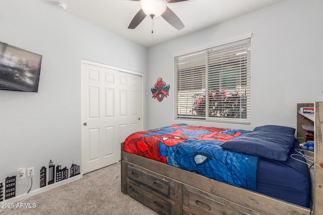 carpeted bedroom with a ceiling fan