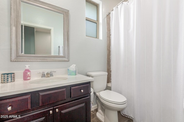 full bath featuring vanity, curtained shower, and toilet
