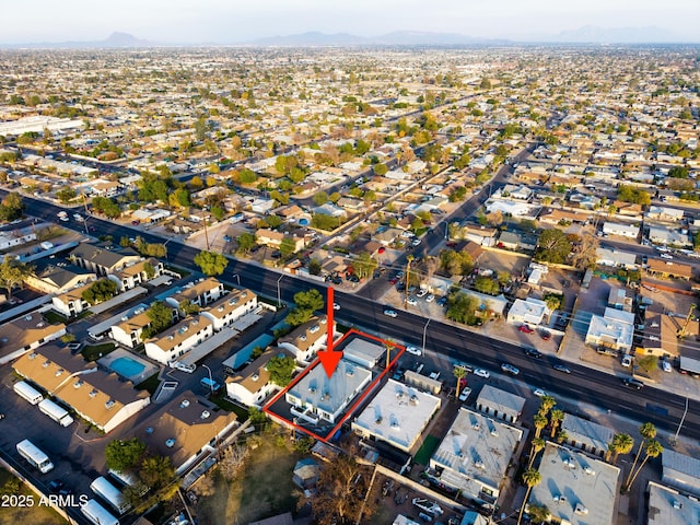 birds eye view of property with a mountain view