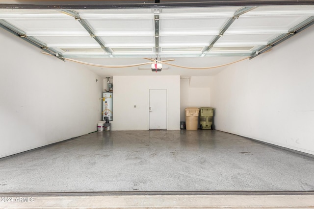 garage featuring water heater and a garage door opener