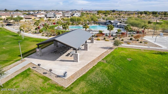 birds eye view of property with a residential view