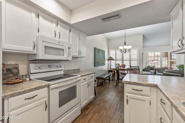 kitchen featuring white cabinets, visible vents, white appliances, and light countertops