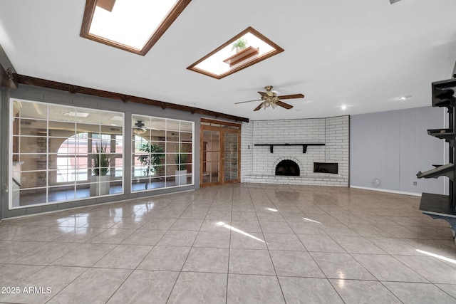 6217 W Orange Dr, Glendale, AZ 85301 - unfurnished living room featuring ceiling fan, tile patterned flooring, and a brick fireplace