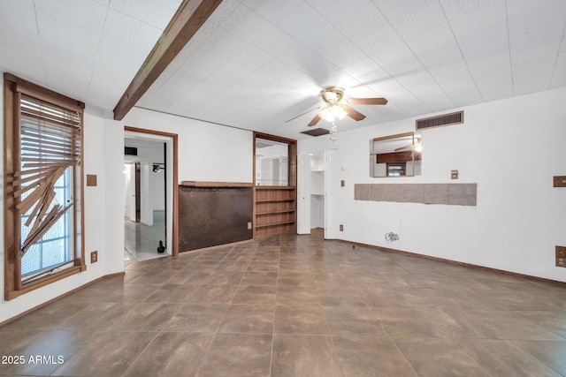 6217 W Orange Dr, Glendale, AZ 85301 - unfurnished living room featuring a ceiling fan and tile patterned floors