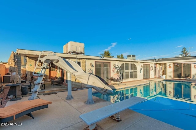 6217 W Orange Dr, Glendale, AZ 85301 - rear view of property with a patio and an outdoor pool