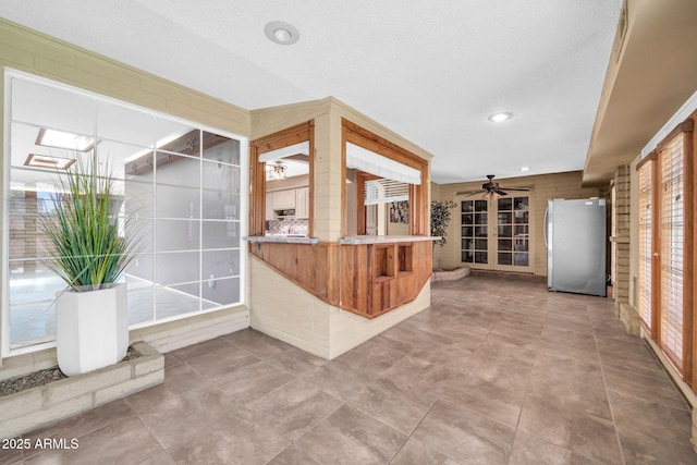 6217 W Orange Dr, Glendale, AZ 85301 - kitchen with freestanding refrigerator, ceiling fan, and recessed lighting