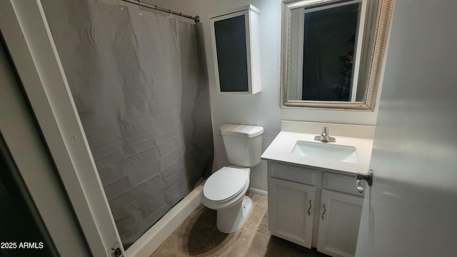 bathroom featuring curtained shower, toilet, vanity, and tile patterned flooring