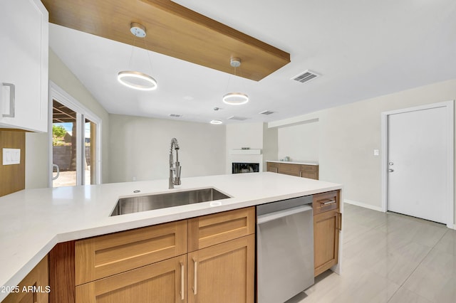 8146 N 17th Dr, Phoenix, AZ 85021 - kitchen featuring dishwasher, a sink, light countertops, and decorative light fixtures