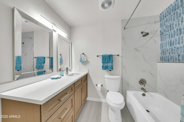 8146 N 17th Dr, Phoenix, AZ 85021 - bathroom with toilet, vanity, bathtub / shower combination, and wood finished floors