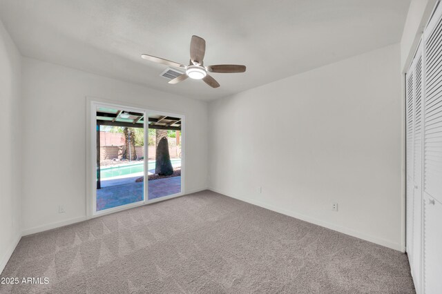 8146 N 17th Dr, Phoenix, AZ 85021 - unfurnished bedroom featuring access to outside, carpet, baseboards, and ceiling fan