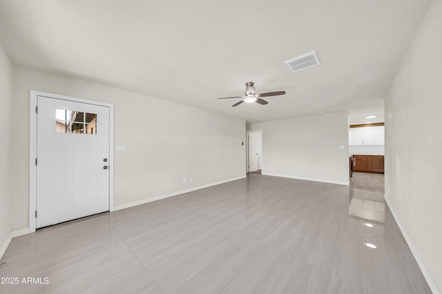 8146 N 17th Dr, Phoenix, AZ 85021 - unfurnished living room featuring ceiling fan, baseboards, and light tile patterned floors