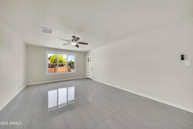 8146 N 17th Dr, Phoenix, AZ 85021 - spare room with tile patterned floors, a ceiling fan, and baseboards