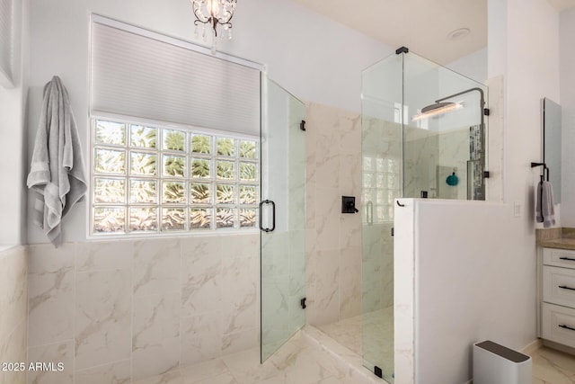 4453 S Huachuca Way, Chandler, AZ 85249 - bathroom with marble look tile flooring, a marble finish shower, and vanity