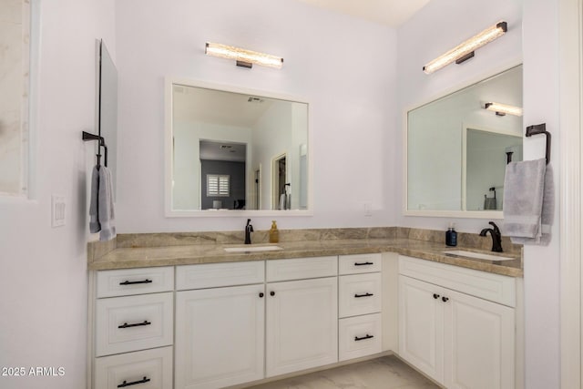 4453 S Huachuca Way, Chandler, AZ 85249 - full bathroom featuring double vanity and marble look tiles