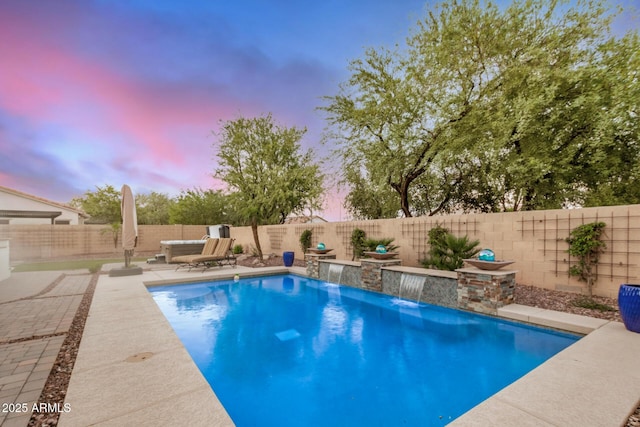 4453 S Huachuca Way, Chandler, AZ 85249 - pool at dusk featuring a patio area and a fenced backyard