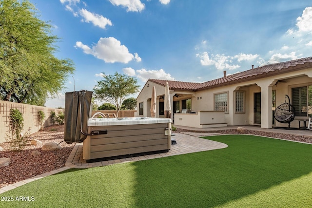 4453 S Huachuca Way, Chandler, AZ 85249 - back of property featuring ceiling fan, a hot tub, a patio area, a fenced backyard, and a tile roof