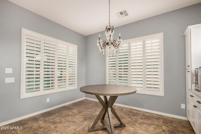 4453 S Huachuca Way, Chandler, AZ 85249 - dining space with a chandelier and baseboards