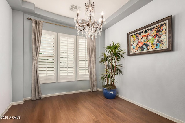 4453 S Huachuca Way, Chandler, AZ 85249 - spare room featuring a chandelier and wood finished floors