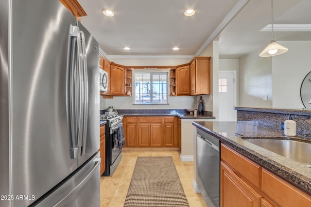 kitchen featuring sink, crown molding, hanging light fixtures, light tile patterned floors, and appliances with stainless steel finishes