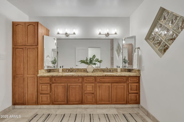 bathroom featuring tile patterned flooring and vanity