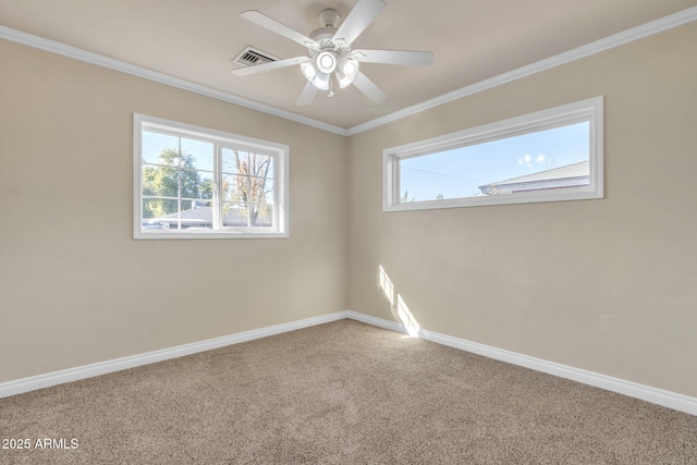 carpeted spare room featuring ceiling fan and ornamental molding