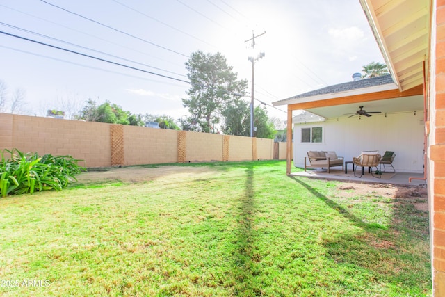 view of yard with a patio area, ceiling fan, and an outdoor hangout area