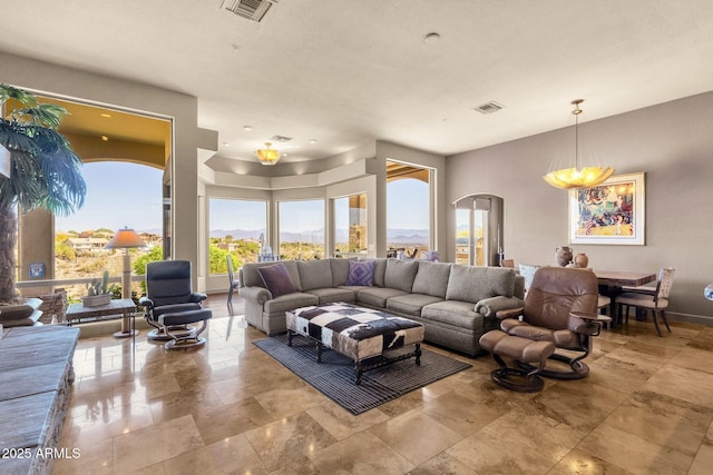 living room featuring visible vents and baseboards