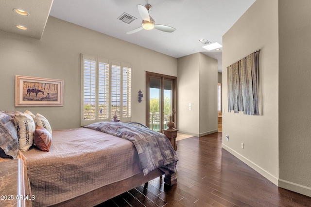 bedroom featuring access to exterior, visible vents, wood finished floors, and baseboards