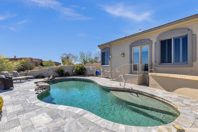view of swimming pool with a patio, a fenced backyard, and a fenced in pool