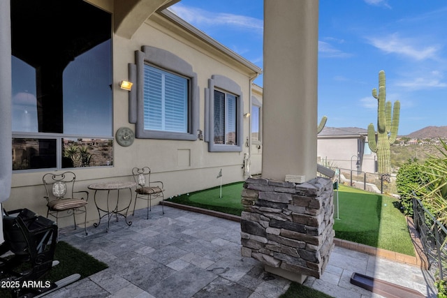 view of patio / terrace with fence