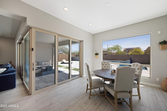 22421 N 34th St, Phoenix, AZ 85050 - dining area featuring light wood finished floors, baseboards, and recessed lighting