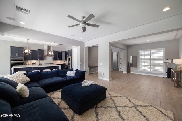 22421 N 34th St, Phoenix, AZ 85050 - living room with visible vents, light wood finished floors, baseboards, ceiling fan, and recessed lighting