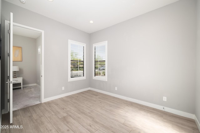 22421 N 34th St, Phoenix, AZ 85050 - unfurnished bedroom featuring baseboards, light wood-style floors, and recessed lighting