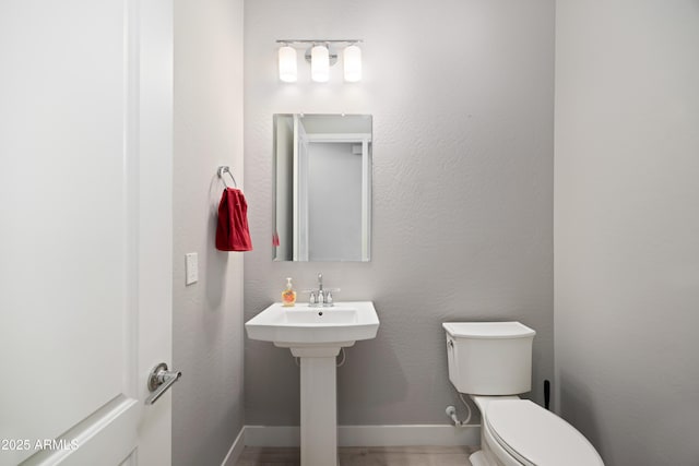22421 N 34th St, Phoenix, AZ 85050 - half bathroom featuring baseboards and toilet