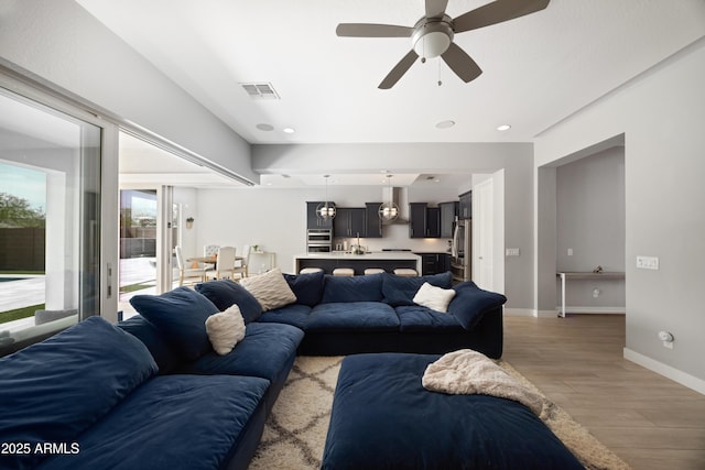 22421 N 34th St, Phoenix, AZ 85050 - living area with baseboards, visible vents, light wood-style floors, ceiling fan, and recessed lighting