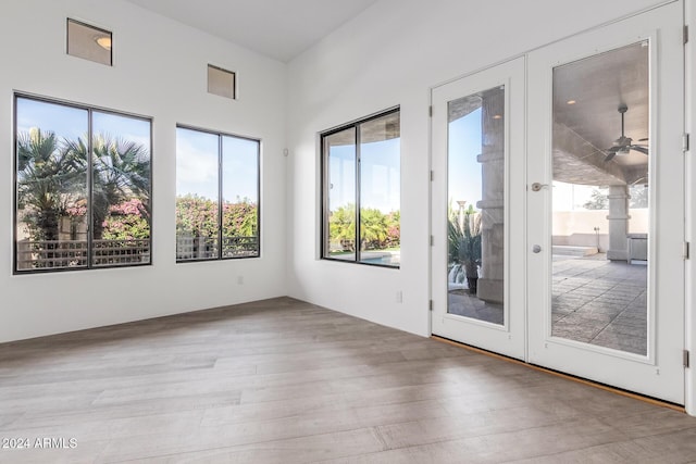 interior space with french doors and ceiling fan