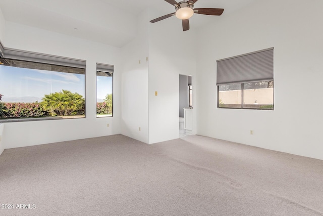 unfurnished room with carpet floors and ceiling fan