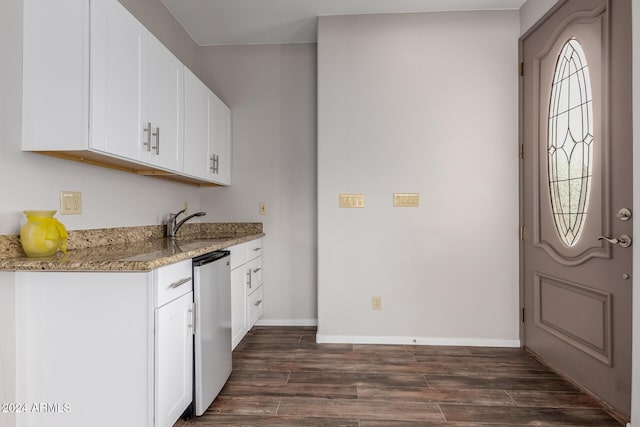 kitchen with white cabinetry, light stone countertops, dishwasher, dark wood-type flooring, and sink