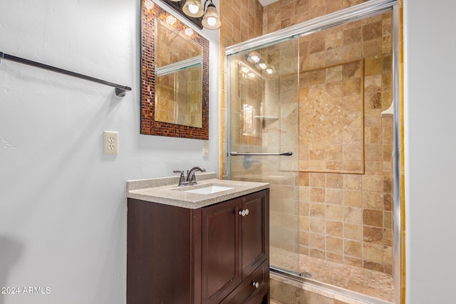 bathroom with vanity and an enclosed shower