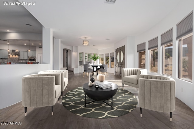 living room featuring hardwood / wood-style floors and a healthy amount of sunlight