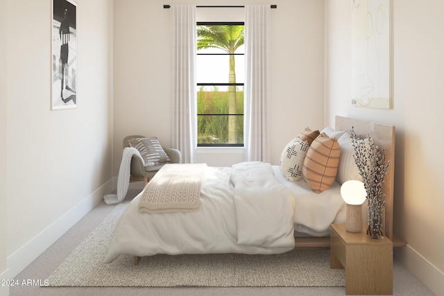 bedroom with carpet floors and multiple windows