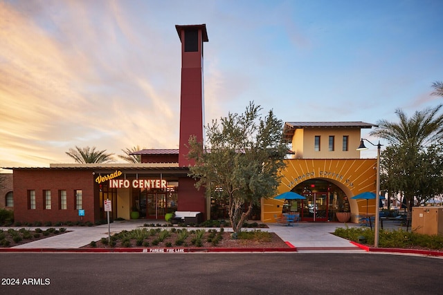 view of outdoor building at dusk