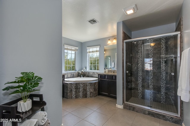 bathroom with tile patterned floors, shower with separate bathtub, and vanity